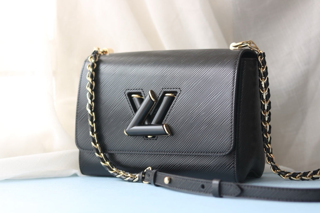 V high quality twist medium handbag 0724033104