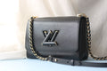 V high quality twist medium handbag 0724033104