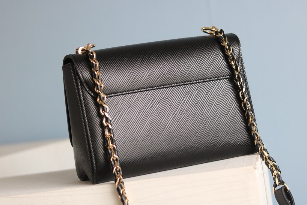 V high quality twist medium handbag 0724033104